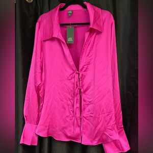 NWT Magenta color long sleeve with tie closure and cuffed sleeve with slit. Nice